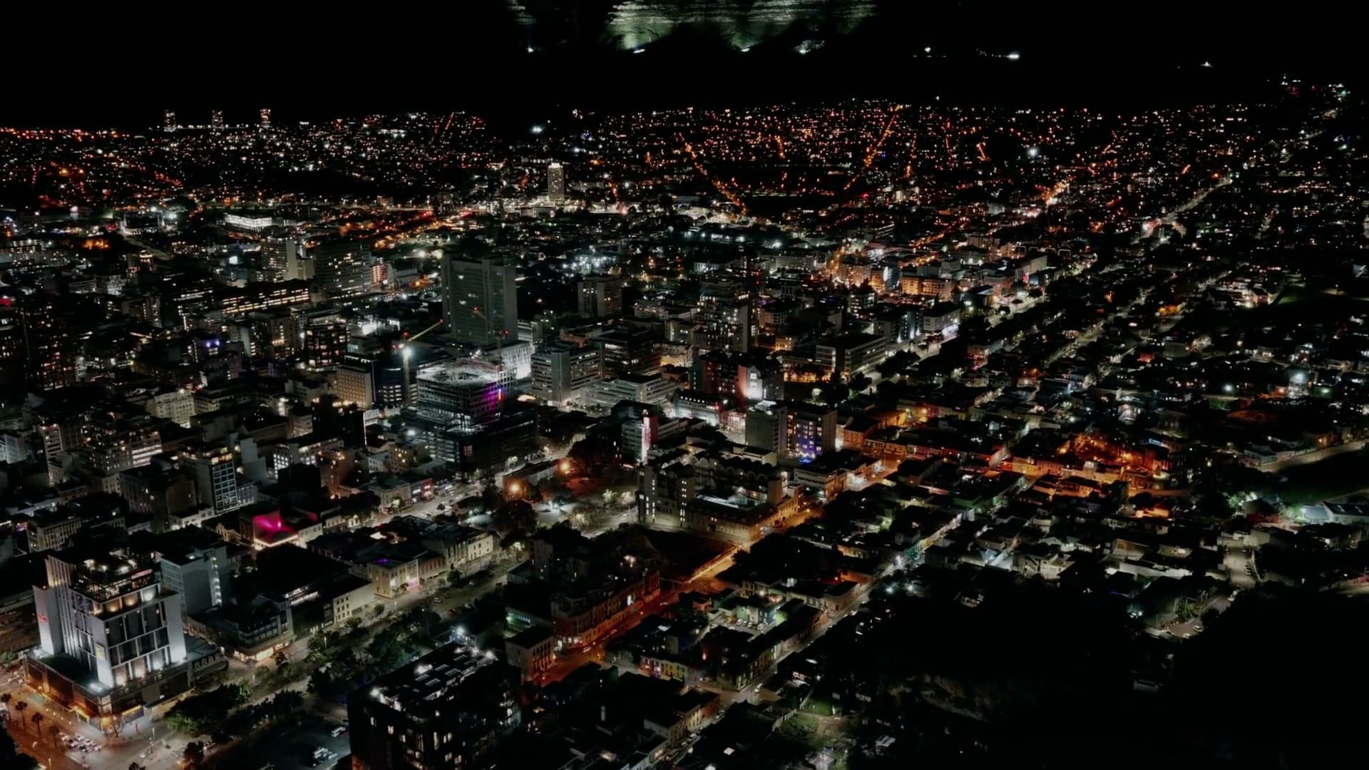 A city at blue hour from the Evryday Jobs montage