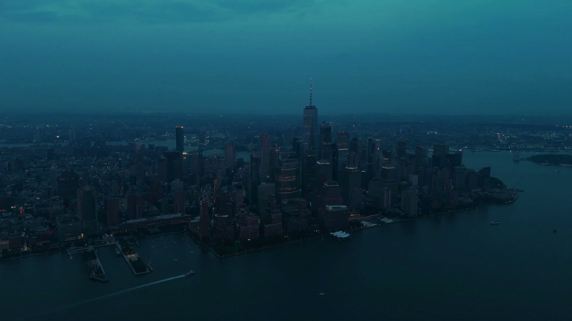 Blue-hour aerial view of a city skyline
